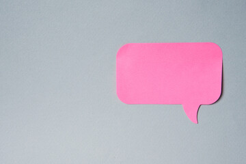 Pink label notification sticker on gray background Copy Space