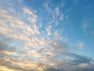 Fototapeta premium beautiful sky with clouds at sunset. Panoranic sunset sky with colorful clouds
