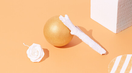 Minimal geometry ball in isometric with brunch decor.  Copy space. Gold trendy colours. Autumn winter background