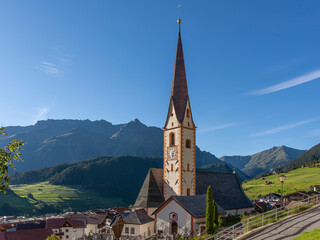 Fototapeta premium The historic center and parish church of Nauders in the Austrian Tyrol, near the border with Italy, Austria