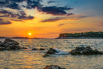 Sunset over rocky beach