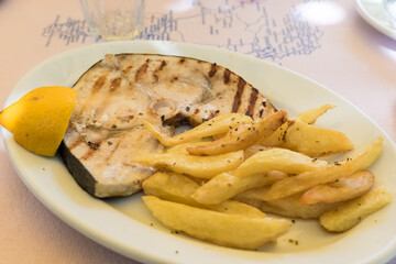 Swordfish with fries and lemon