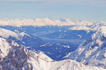 Panoramic landscape and scenic view over Alpine mountains and mountain range from Zugspitze summit...