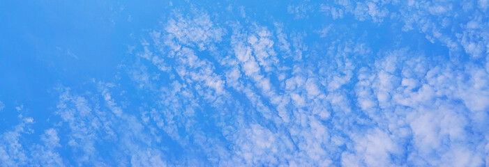 Fototapeta na wymiar Blue sky with white clouds as a panorama background.