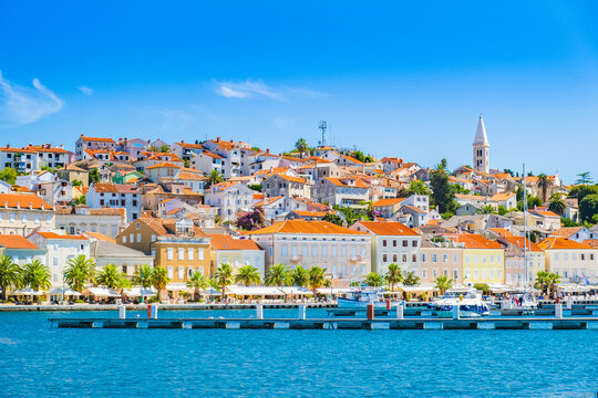 Town of Mali Losinj on the island of Losinj, Croatia, seafront and city skyline with old cathedral tower
