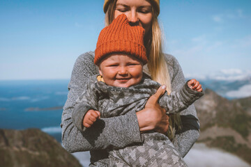Fototapeta na wymiar Baby with mother family travel lifestyle vacation woman hiking with infant child happy emotions healthy lifestyle kid smiling portrait outdoor