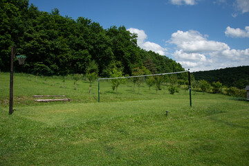 badminton court, basketball volleyball near the forest