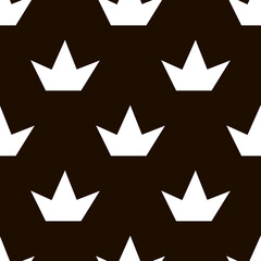 .A repeating pattern of white crowns on a black background; background of light objects on dark; fashionable pattern; cheerful pattern; blank for creativity; pattern for fabric and paper.