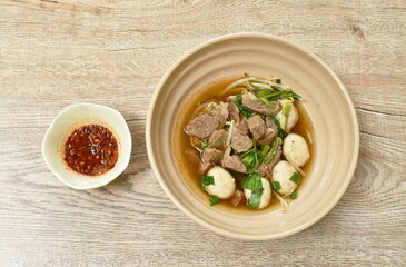 dry braised pork and ball with bean sprout  on bowl dipping spicy sauce