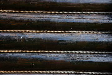 wooden beams at a cottage isolated with rope in Romania,Bistrita