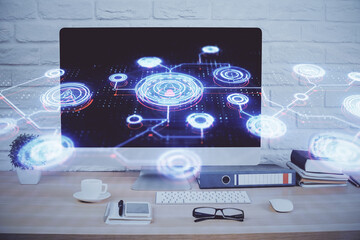 Fototapeta premium Computer on desktop with social network hologram. Double exposure. Concept of international people connections.