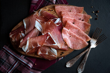 Italian prosciutto or jamon with rosemary, raw ham