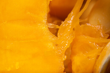 Fototapeta na wymiar Background with closeup pulp of the inner part of pumpkin in soft focus