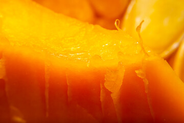Background with closeup pulp of the inner part of pumpkin in soft focus