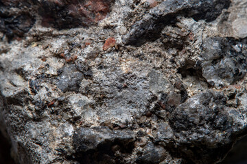 Stone surface texture at high magnification with numerous chips and small details
