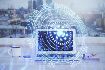 Double exposure of desktop computer and technology theme hologram. Concept of software development.