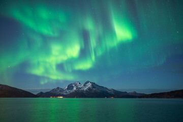 Fototapeta na wymiar Aurora borealis over mountains in Arctic Norway