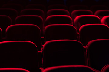 Empty cinema hall with red seats. Movie theatre