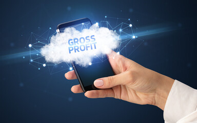 Female hand touching smartphone with GROSS PROFIT inscription, cloud business concept