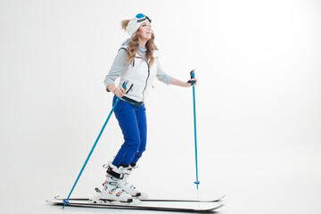 young woman goes skiing. Skier maneuvers on mountain skis, photos on a white background in the...