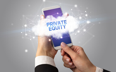 Obraz premium Female hand touching smartphone with PRIVATE EQUITY inscription, cloud business concept