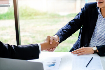 Successful businessman handshake at meeting.