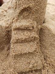 Entrance for a sand castle on the beach