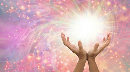 Healing is a magical experience  - female hands with with white light and a flow of sparkles...