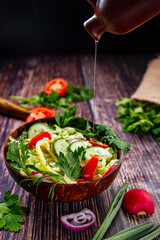salad with vegetables on a wooden table