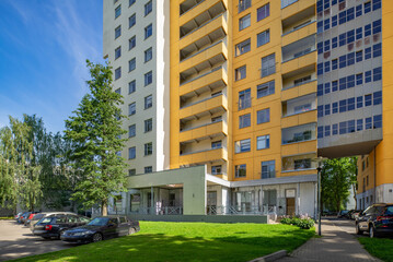 Obraz na płótnie Canvas Modern city architecture of living complex. Sunny summer day. Exterior of residential building.