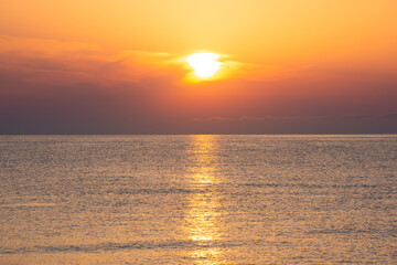 Beautiful orange sunrise or sunset at sea