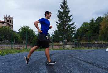 young man running in a park