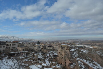 Historical caves, snowy mountains, fairy chimneys and settlements in Cappadocia.