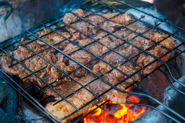 Roasted beef on charcoal grilled Isan Thai food that is bold and delicious.