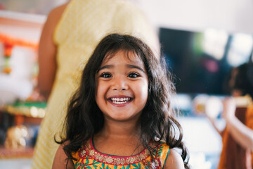 Portrait of indian female kid wearing sari dress - Southern asian child having fun smiling in front...