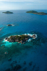 Aerial panorama of the Marine reserve of Coco island with the blue Indian Ocean, Seychelles
