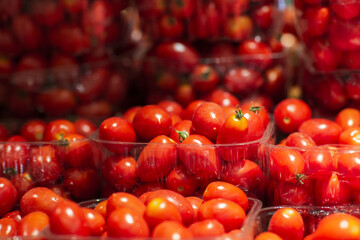 tomatoes in a basket. Organic and healthy red cherry tomatoes on the market