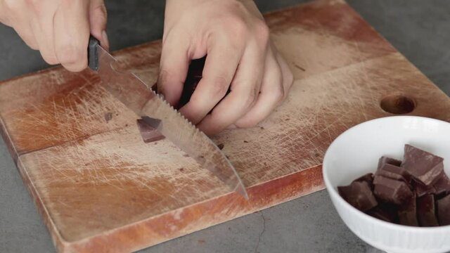 Close up of a chef mixing ingredients, melting chocolate and butter for brownies