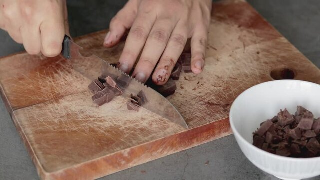 Close up of a chef mixing ingredients, melting chocolate and butter for brownies