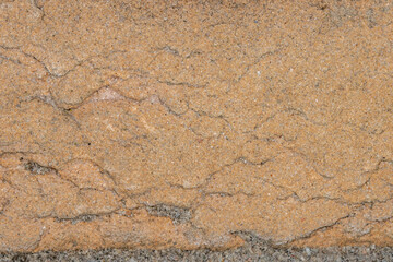 Red sandsone brick background with mortar line at base