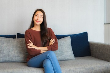 Portrait beautiful young asian woman relax smile on sofa
