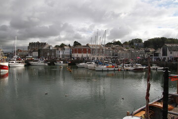 Fototapeta na wymiar A view of Padstow Harbour in Cornwall showing the fishing boats in the evening