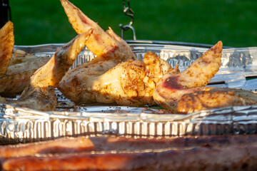 meat from chicken and pork  on barbecue grill cooked for summer family dinner concept