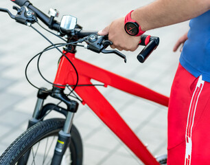 Man red bike handle grips close up