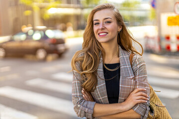 Portrait of attractive young woman outdoors
