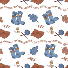 Seamless pattern with warm knitted socks, a clew of knitting needles and a home pillow