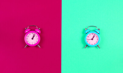 The watch is set against a mint and crimson background.