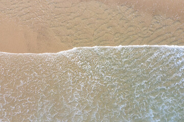 The Atlantic Ocean washes onto a scenic, sandy beach on Cape Cod, Massachusetts. This scenic peninsula is a popular summer vacation destination in New England.
