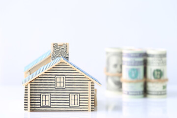 Model house with banknote on white background, Finance and Banking