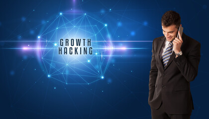 Businessman thinking about security solutions with GROWTH HACKING inscription